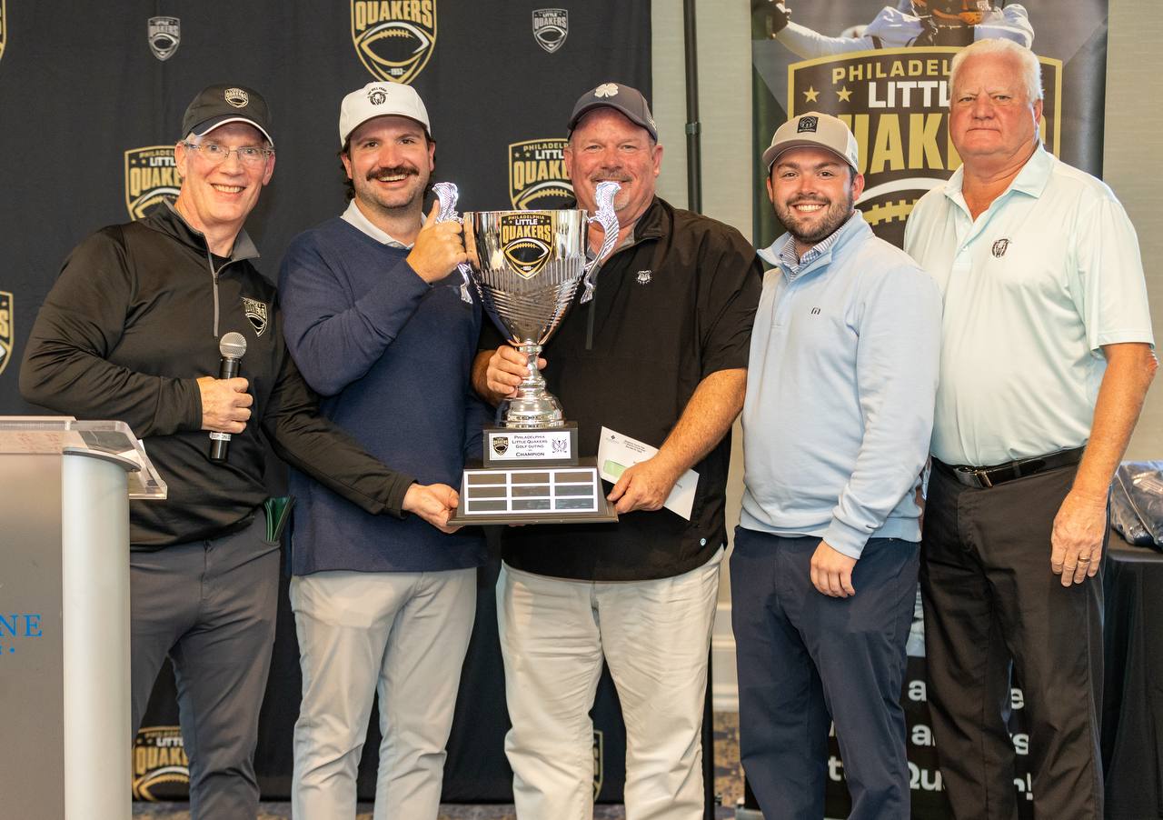 The 2026 winning foursome with the Little Quakers Cup