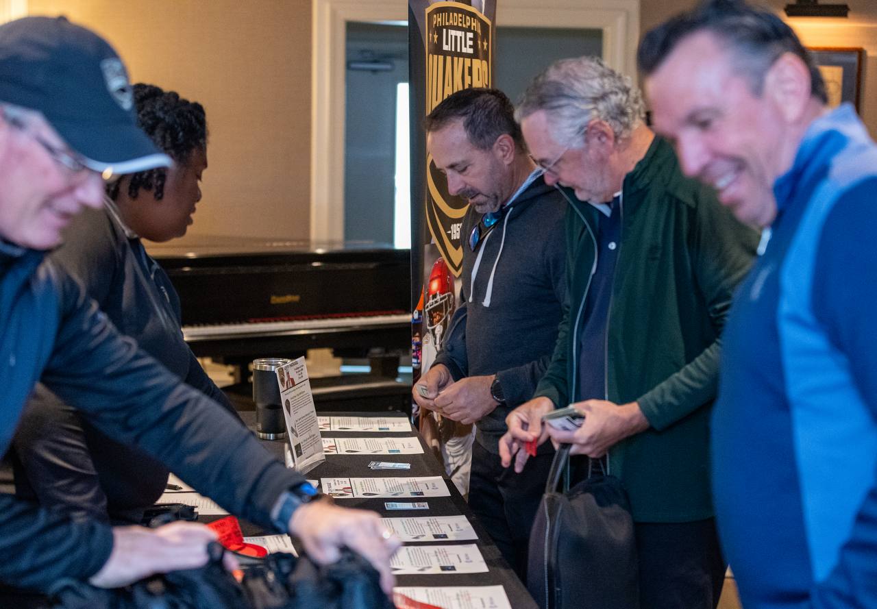 Players checking in at the registration table